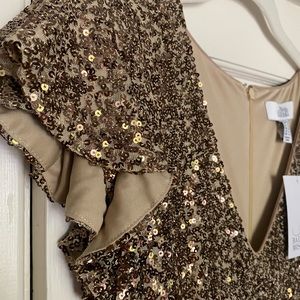 Gold sequined gown by Belle by Badgley Mischka